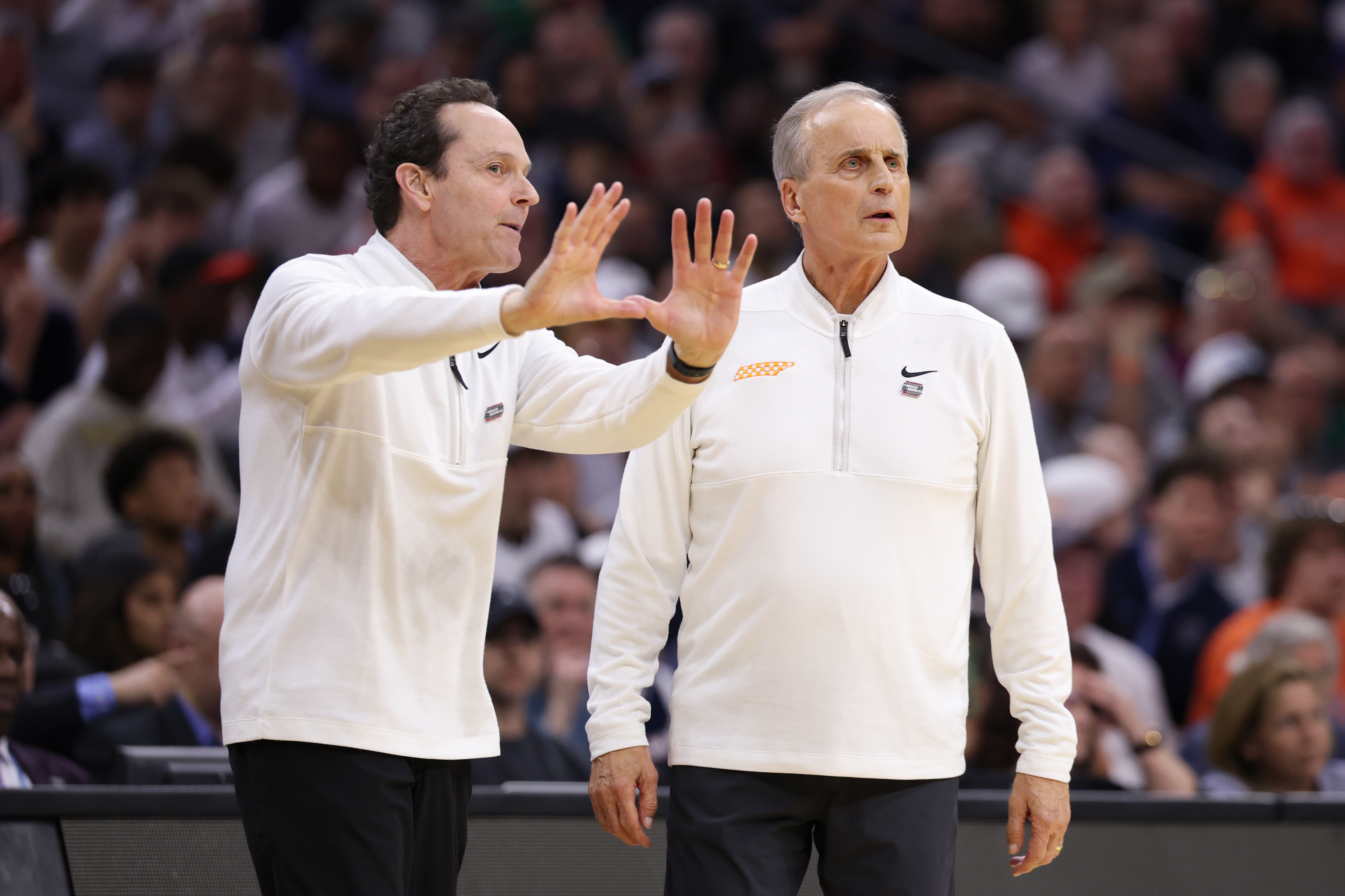 Tennessee assistant Gregg Polinsky and head coach Rick Barnes talk strategy during a 2026 NCAA Tournament game