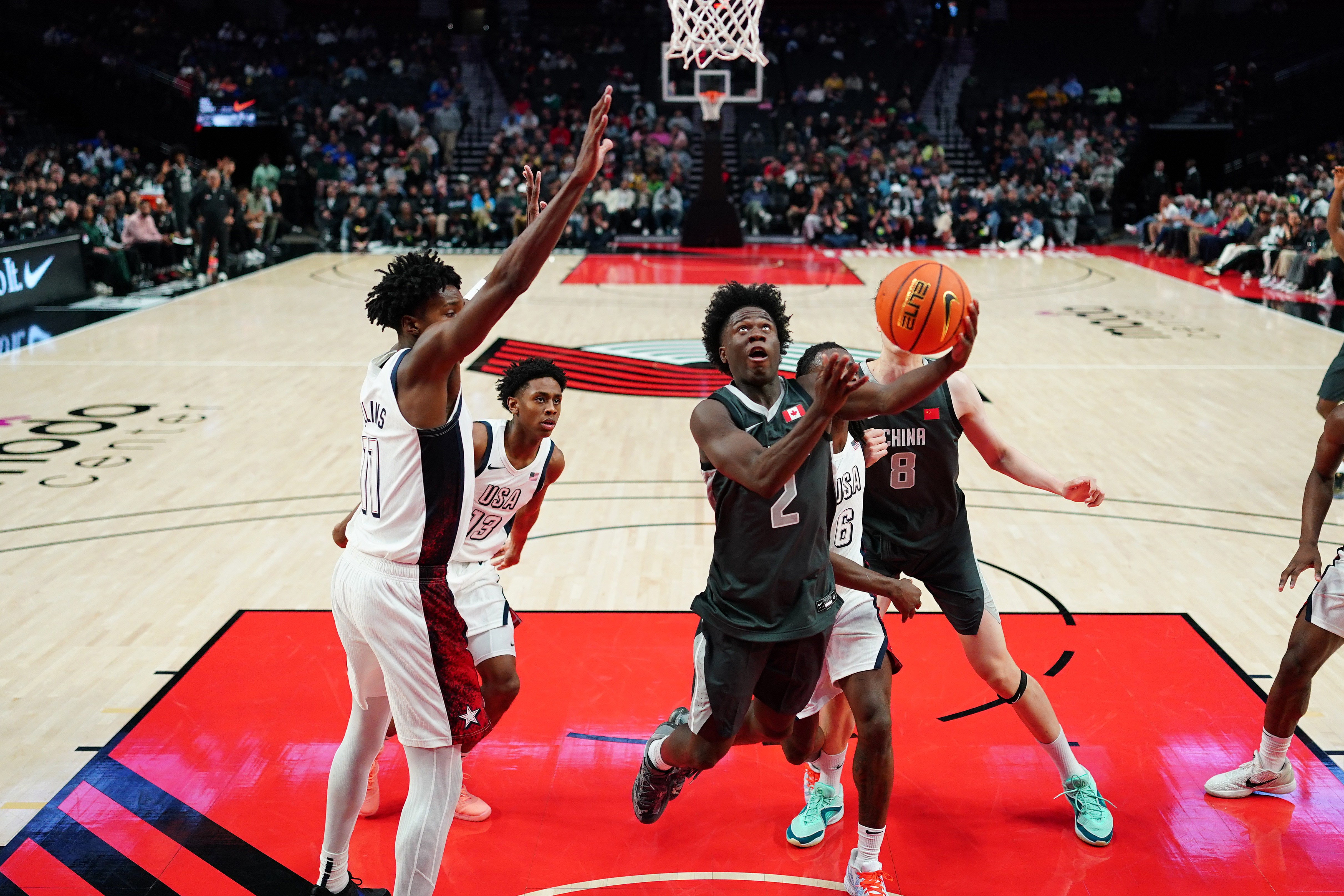 Miles Sadler, playing for Team World, attempts a layup against Team USA at the 2026 Nike Hoop Summit