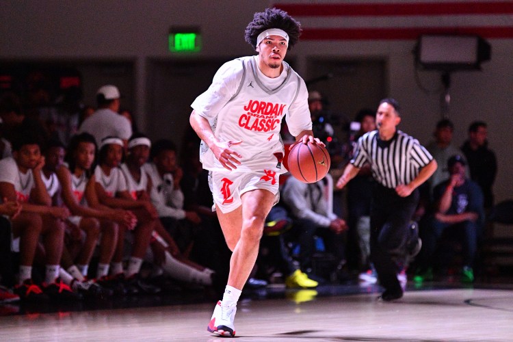 Tyran Stokes dribbles the ball up the court during the Jordan Brand Classic high school All-Star game