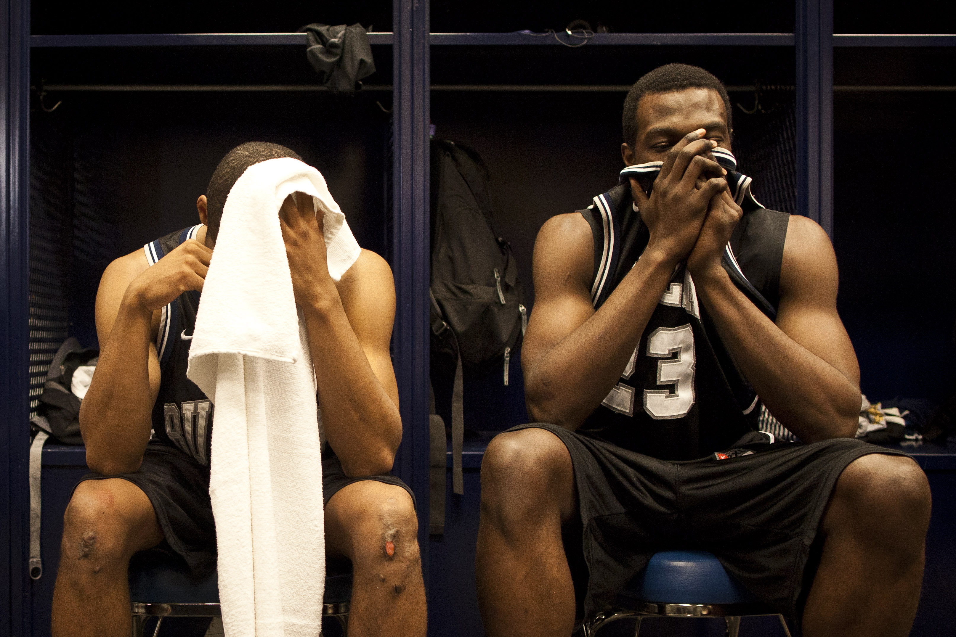Nored covers his face in the locker room after Butler lost the 2011 NCAA Title Game