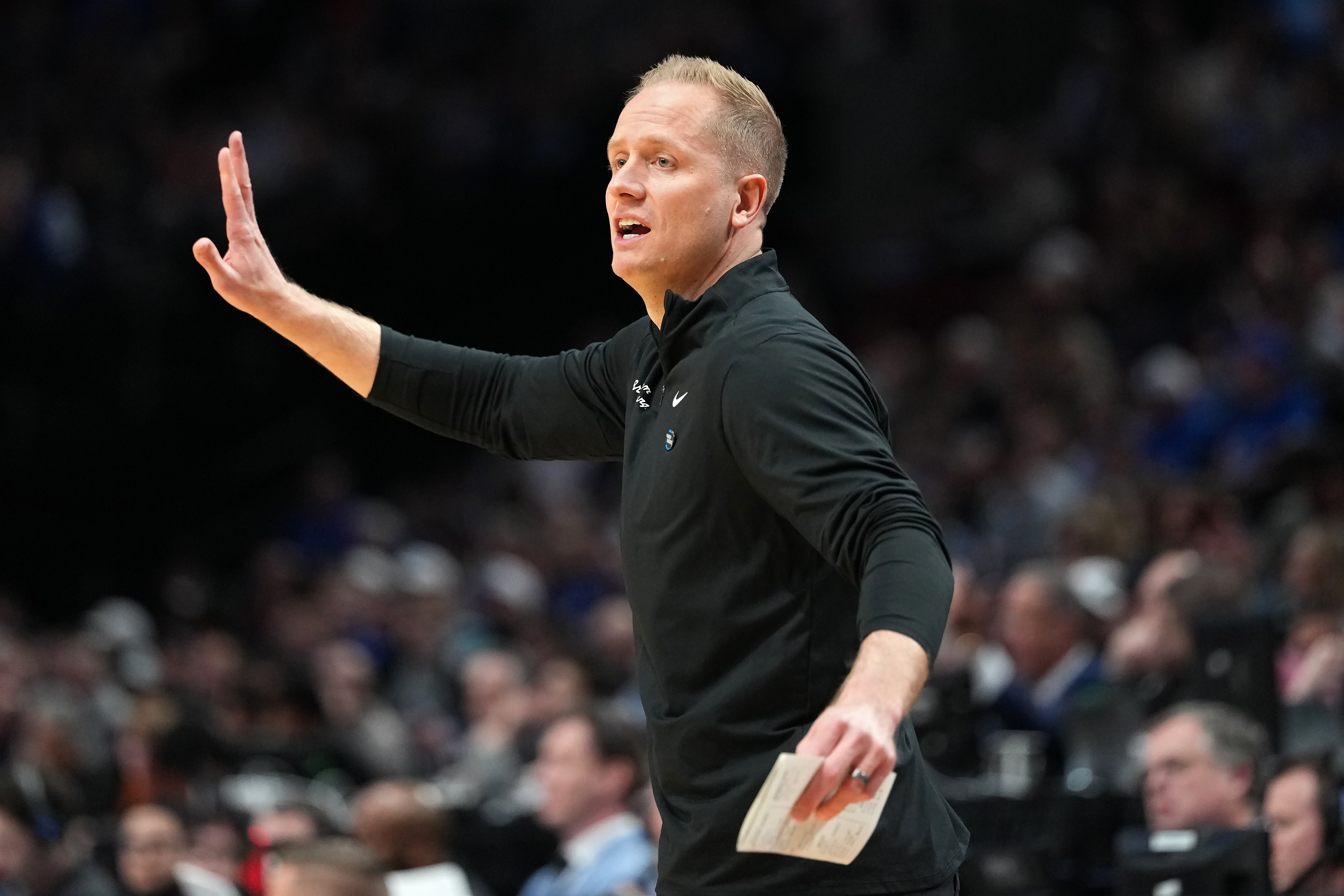 BYU's Kevin Young coaching from the sidelines during a 2026 NCAA Tournament game