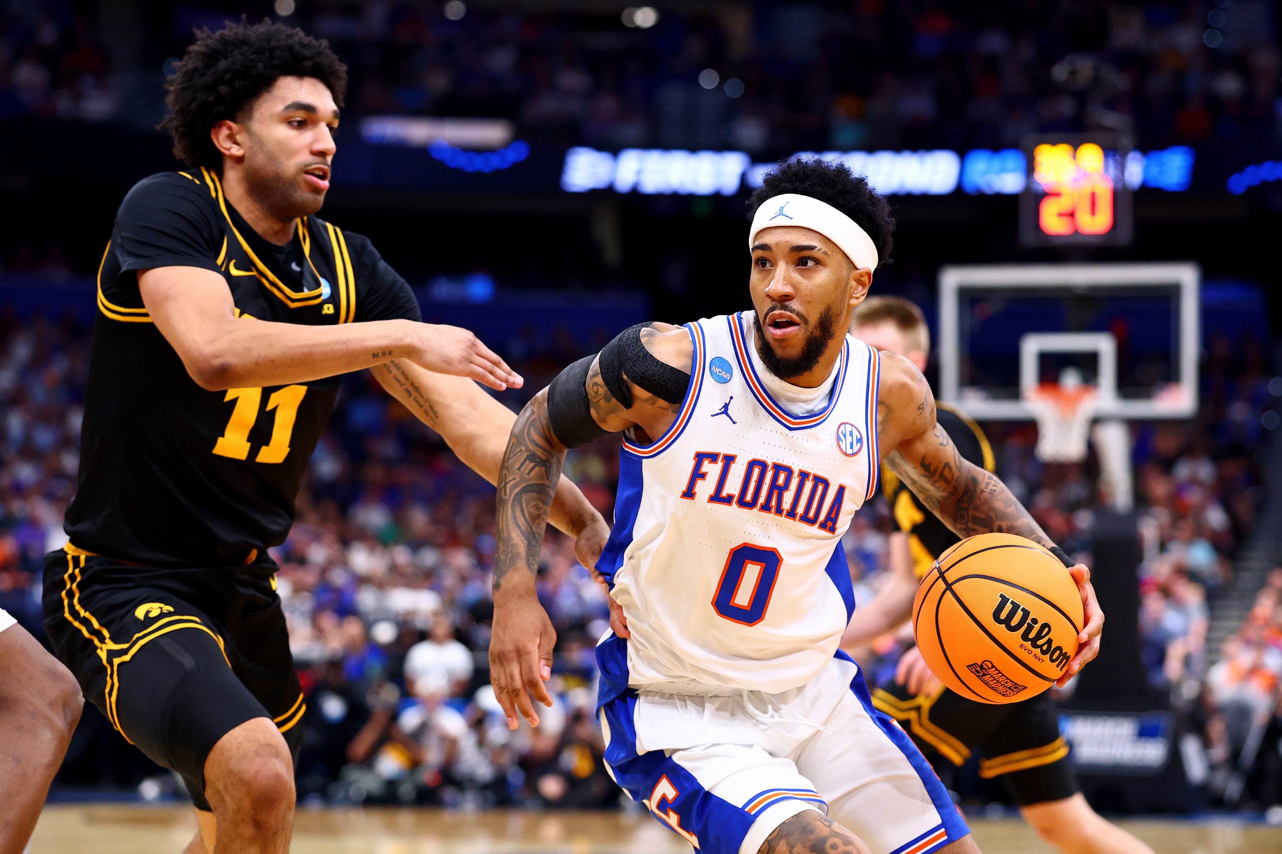 Florida guard Boogie Fland dribbles past an Iowa defender during the 2026 NCAA Tournament
