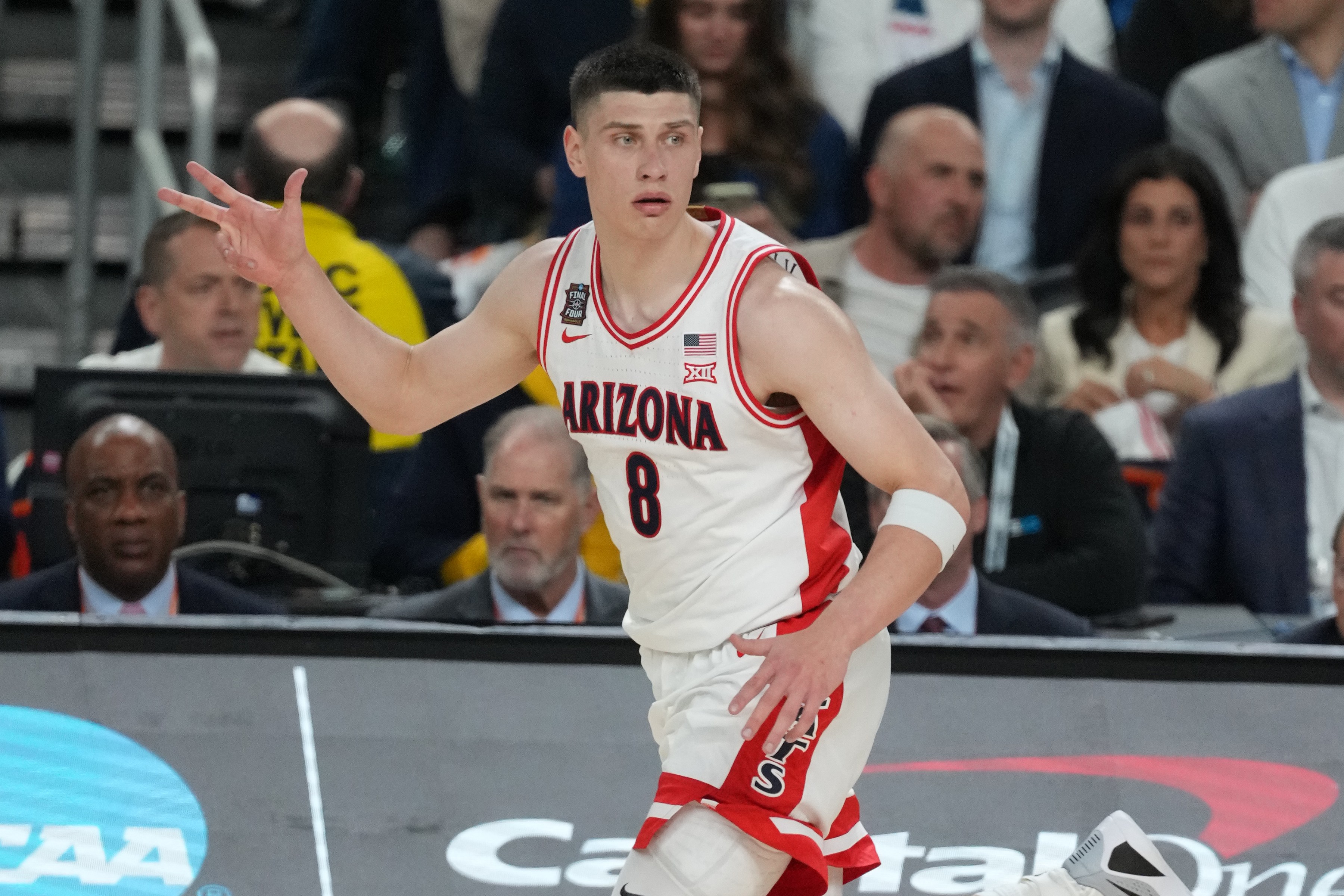 Arizona's Ivan Kharchenkov celebrates hitting a shot during the 2026 National Semifinal game against Michigan