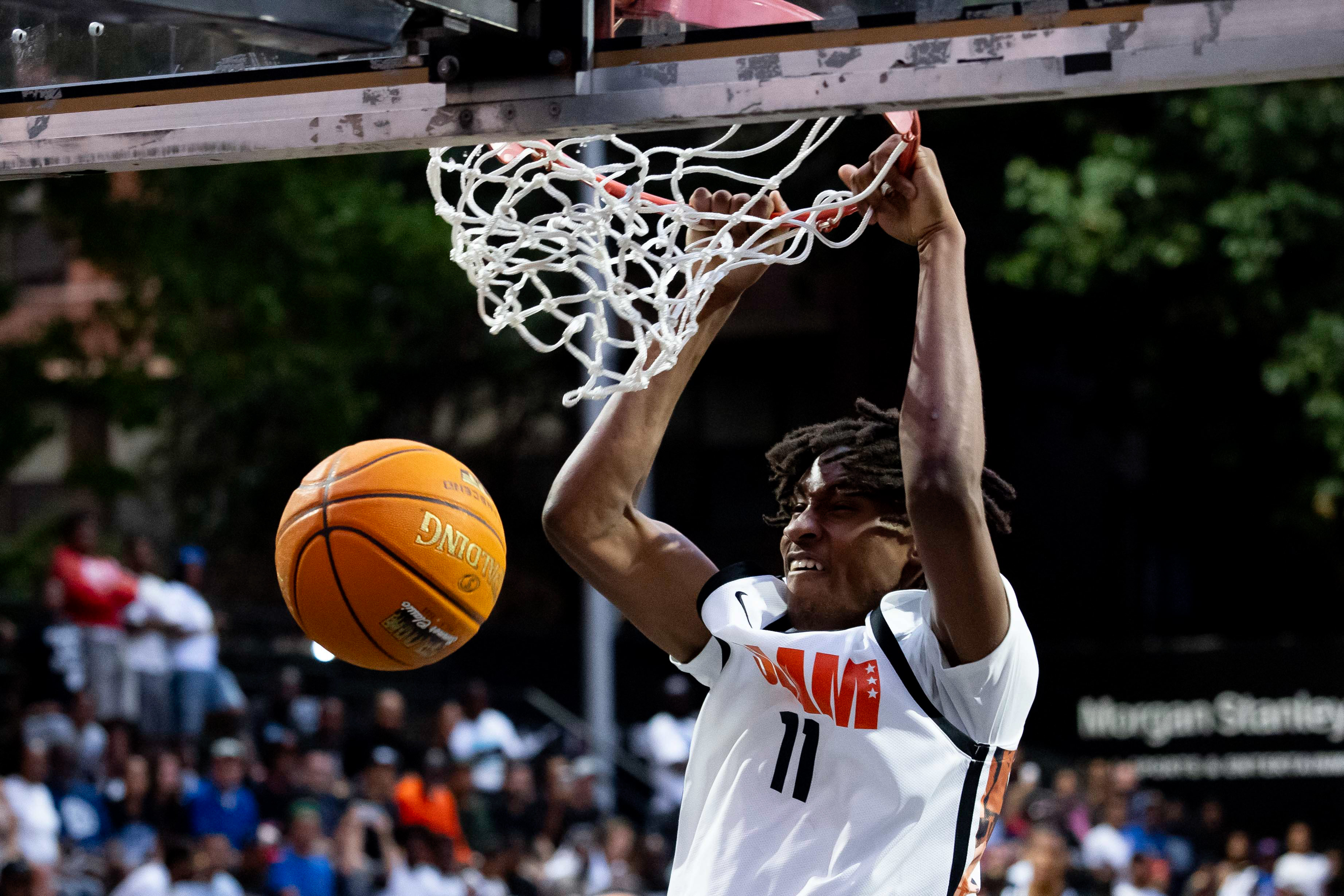 High school basketball star Moussa Kamissoko throws down a two-handed dunk during the SLAM Summer Classic at Rucker Park