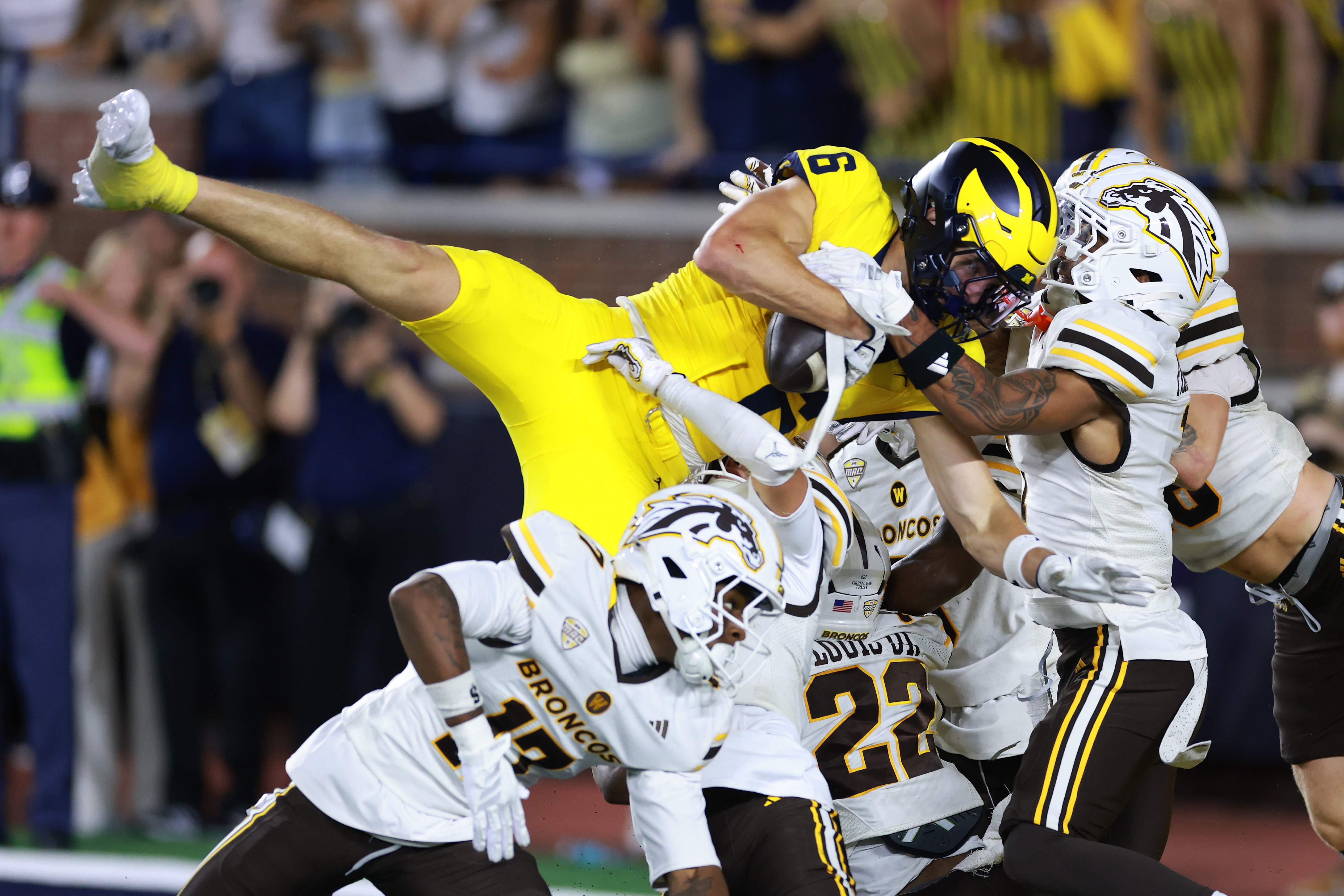 Michigan's JJ Buchanan catches a touchdown pass with no time left on the clock to beat the Western Michigan Broncos 13-12
