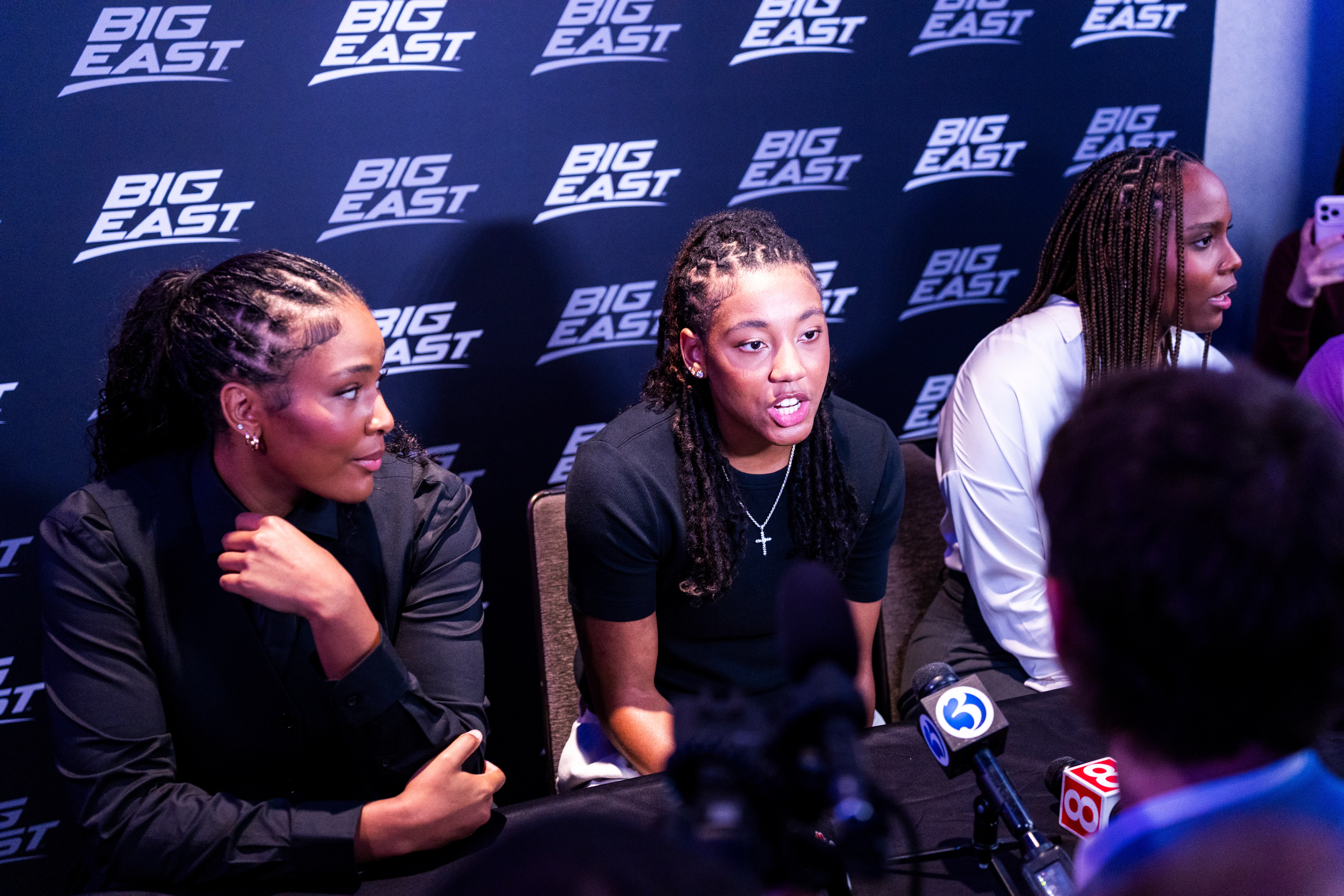 From left: Sarah Strong, KK Arnold and Blanca Quiñonez speak with reporters at 2026 Big East Media Day