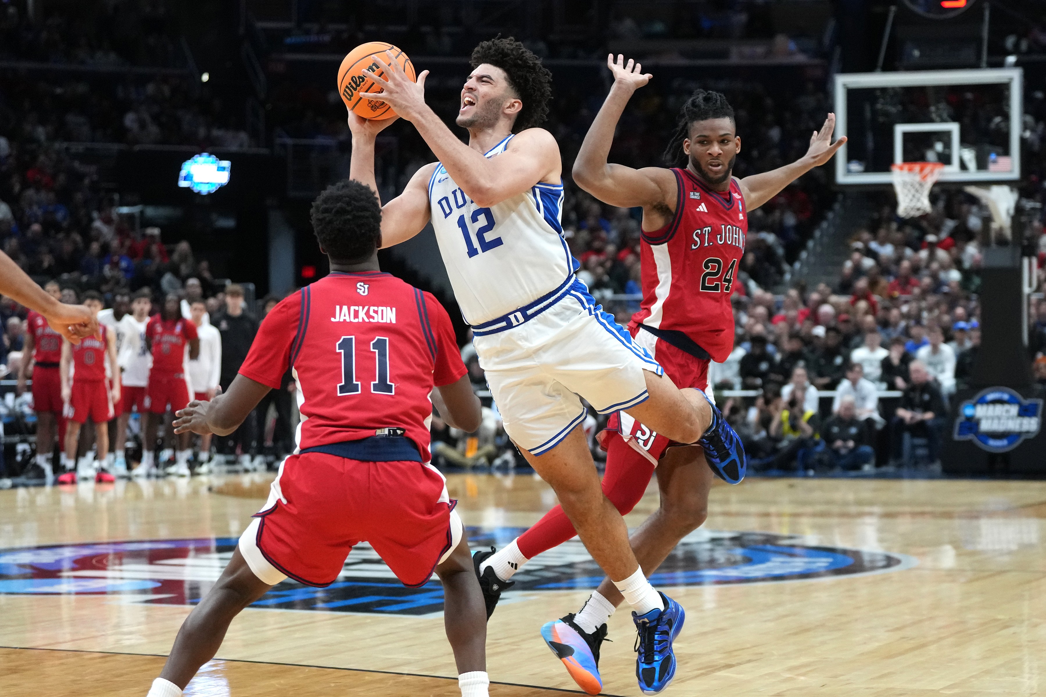 Jackson and Ejiofor defend Duke freshman Cameron Boozer during last season's NCAA Tournament
