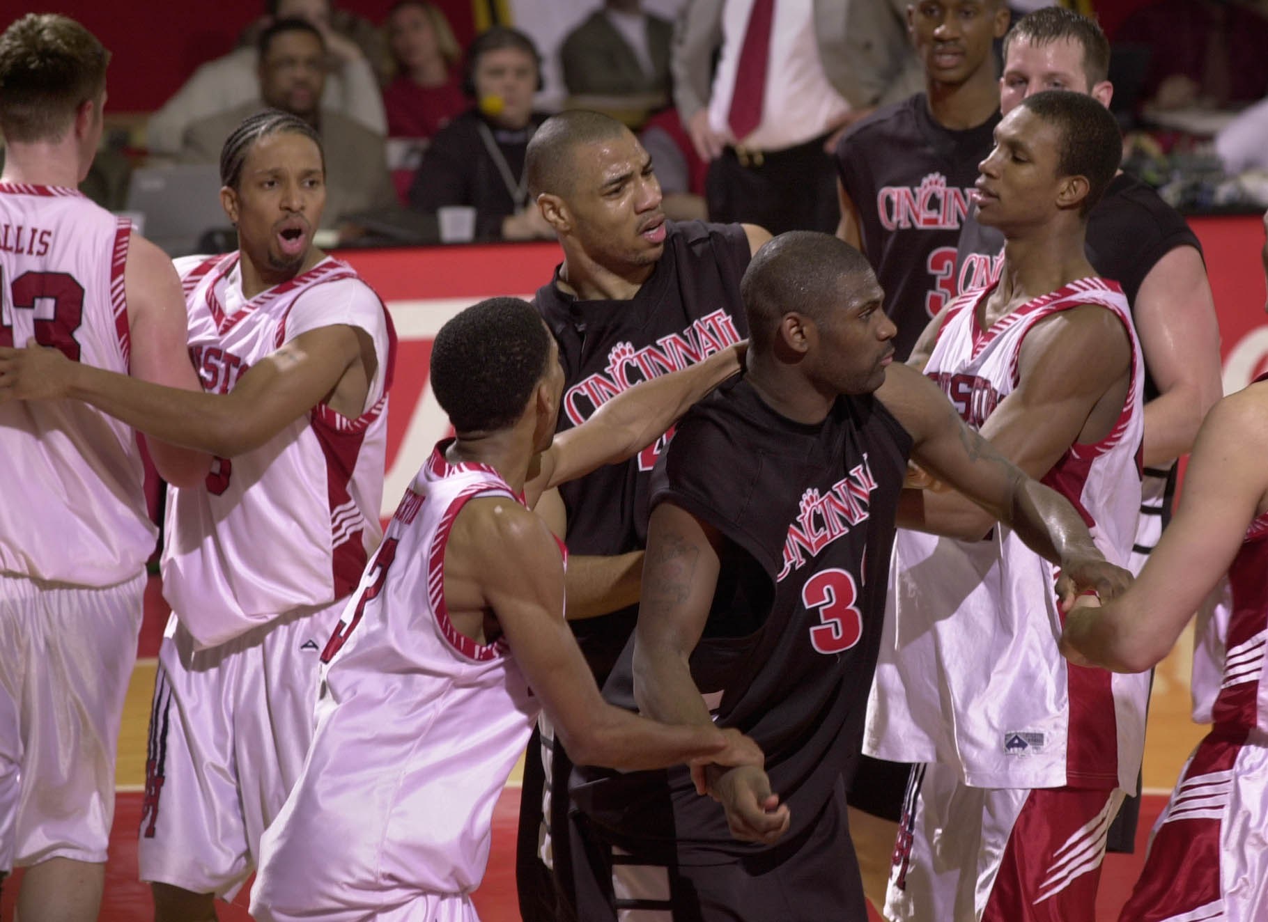 Kenyon Martin holds back Pete Mickeal during a brawl with Houston players