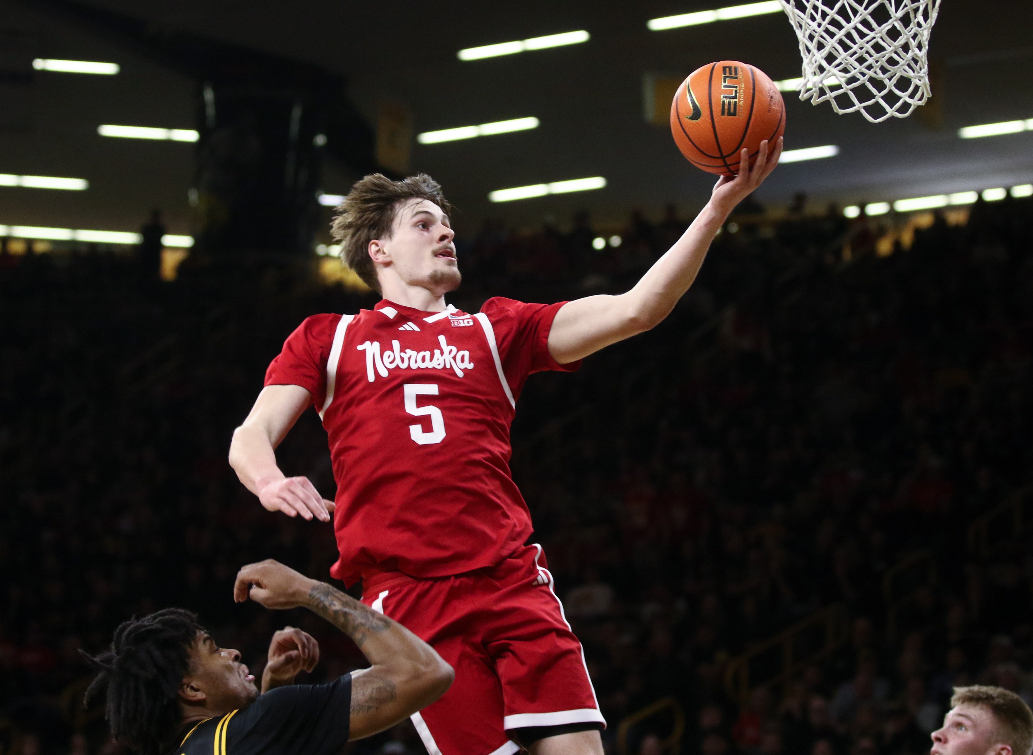 Braden Frager rises over an Iowa defender for a layup