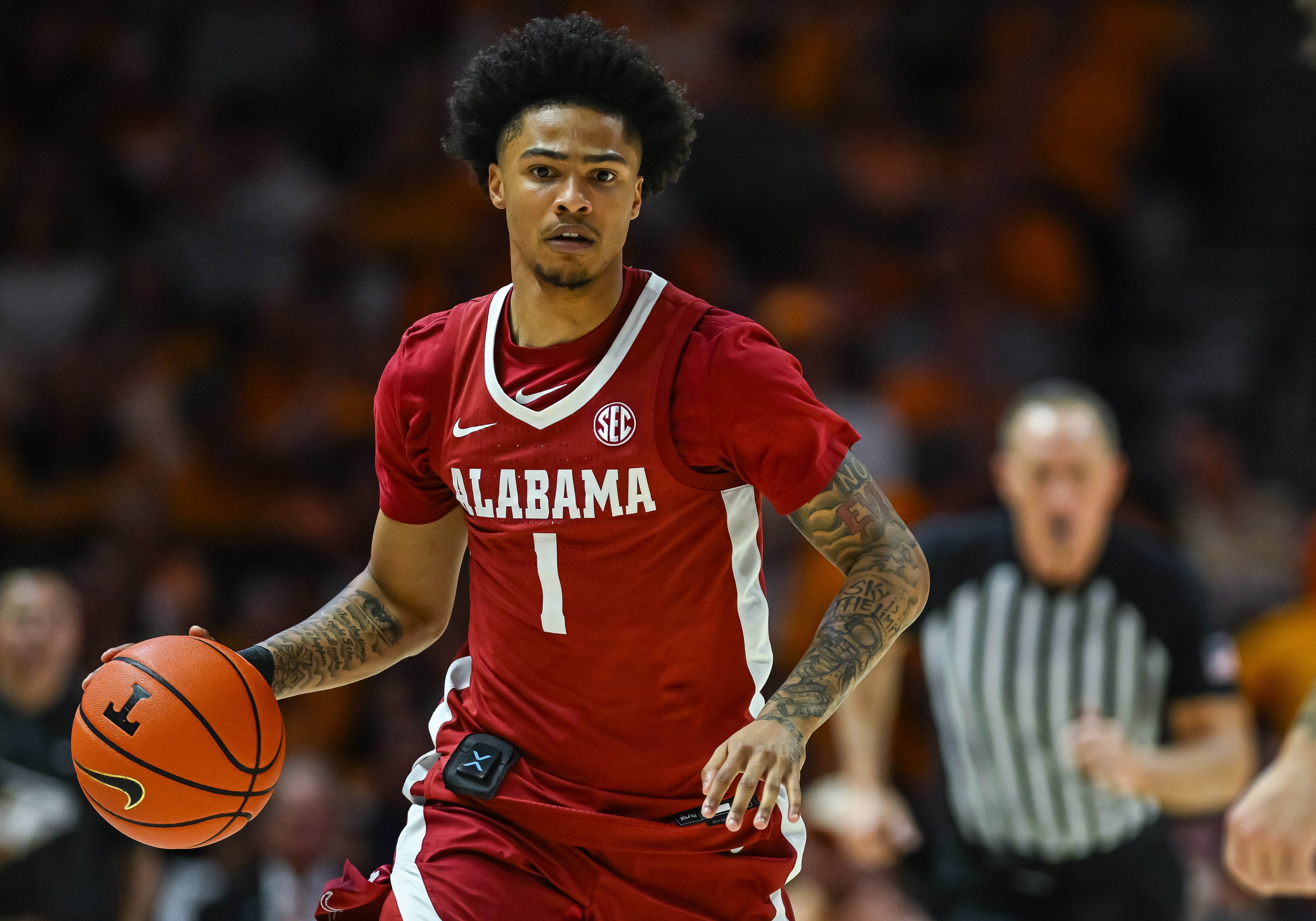 Alabama guard Jalil Bethea takes the ball up court