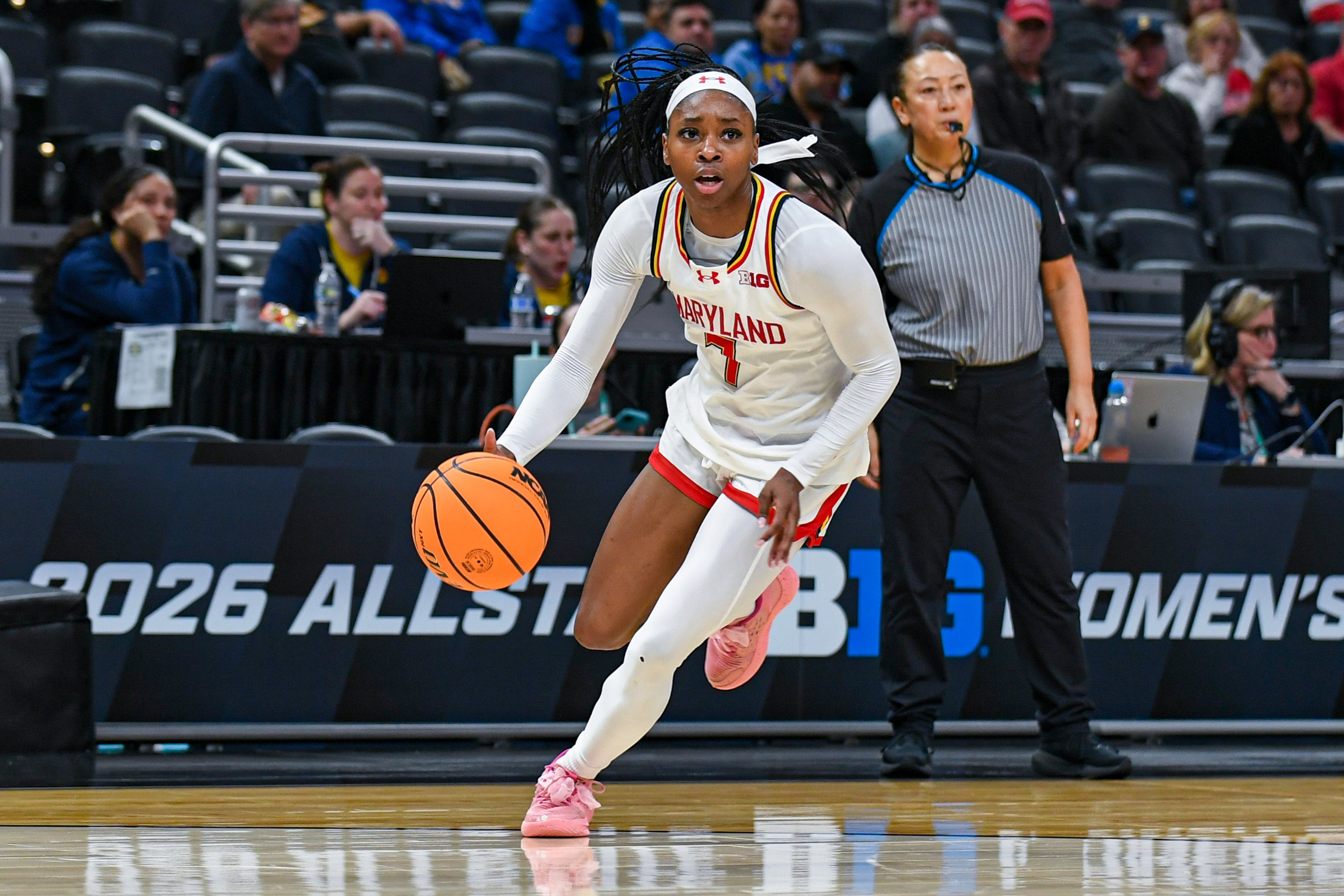 Maryland guard Oluchi Okananwa taking the ball up court