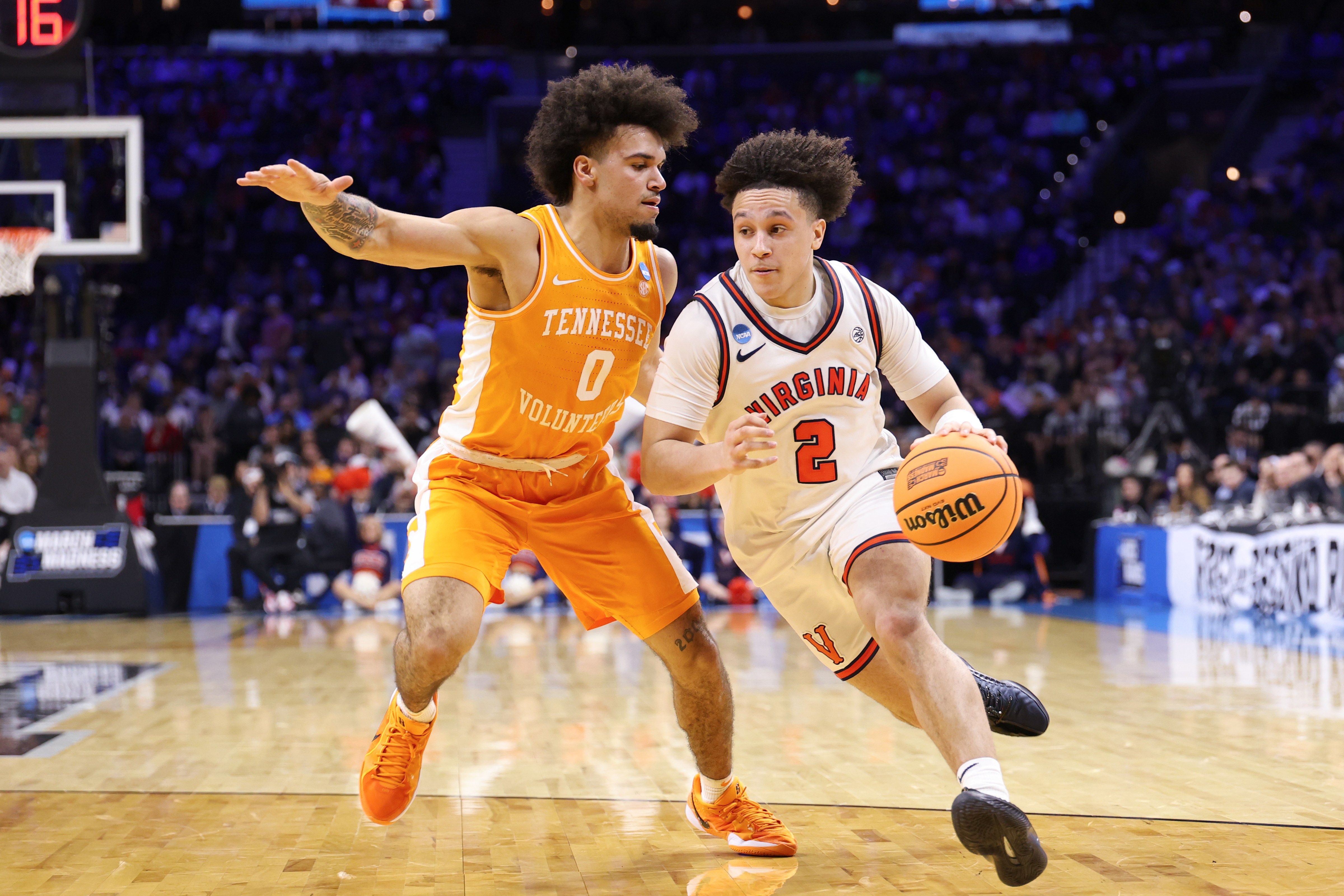 Virginia guard Chance Mallory attempts to drive past a Tennessee defender