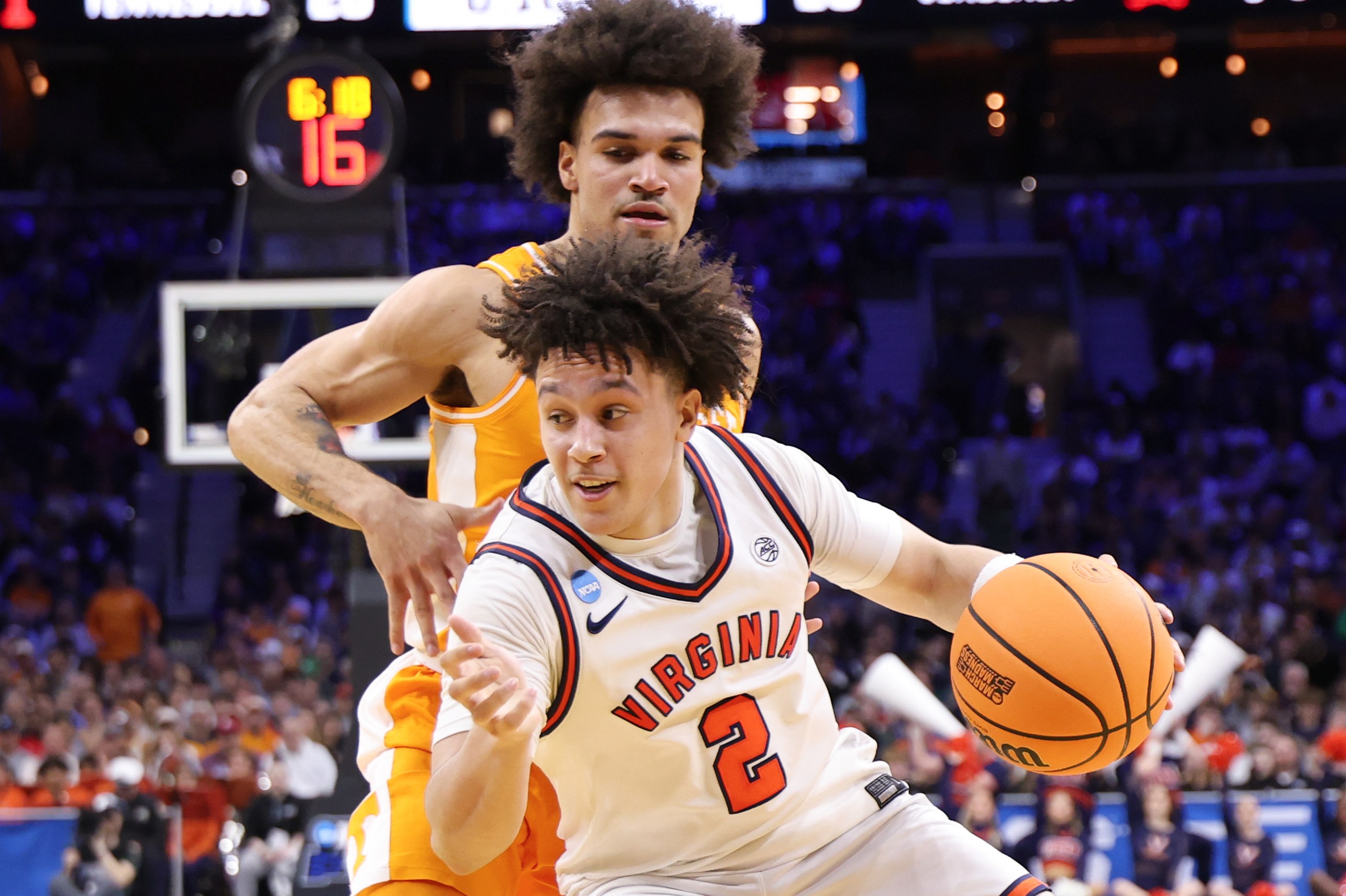 Virginia guard Chance Mallory drives past a Tennessee defender