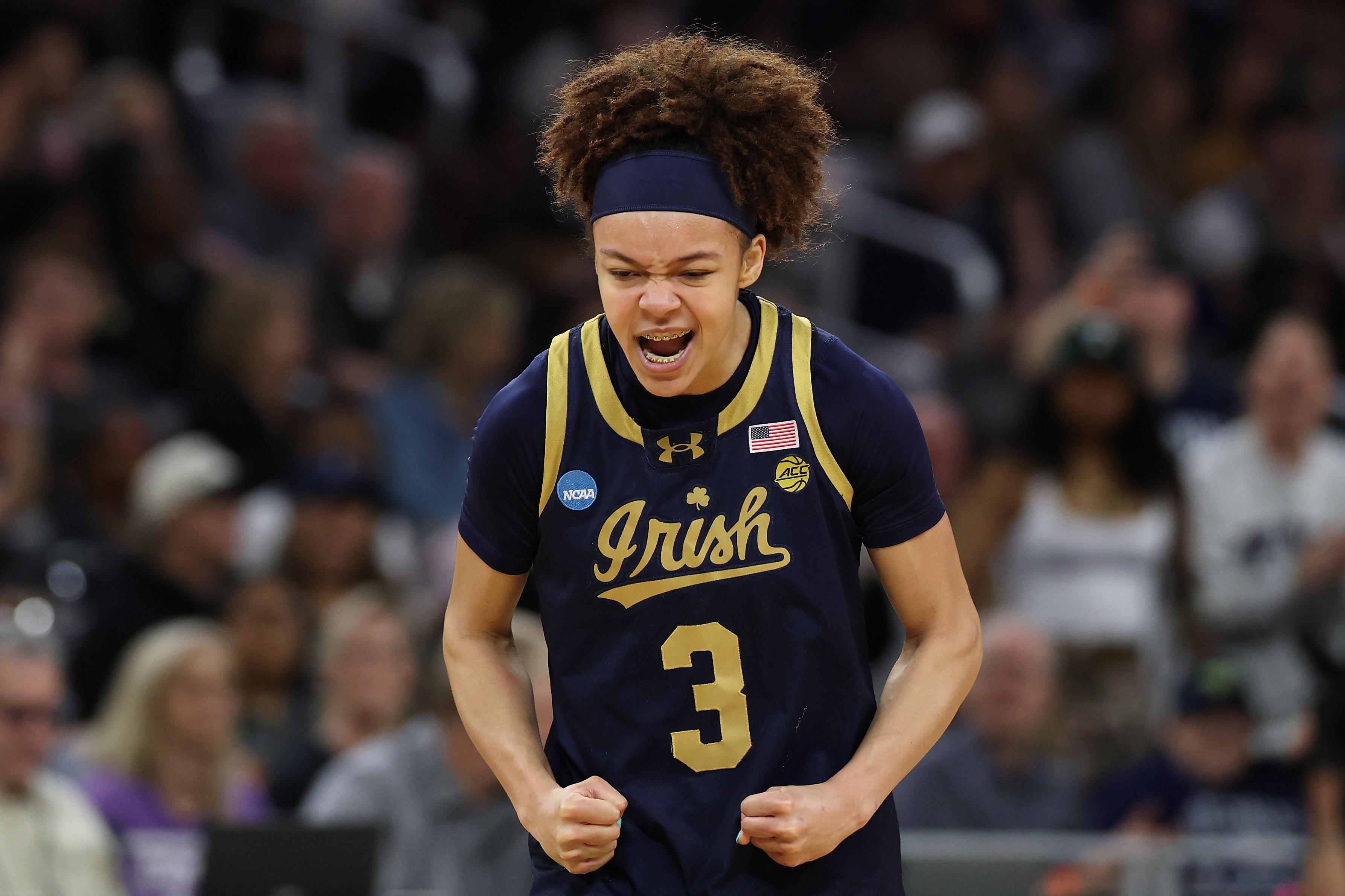 Notre Dame's Hannah Hidalgo celebrates after hitting a bucket