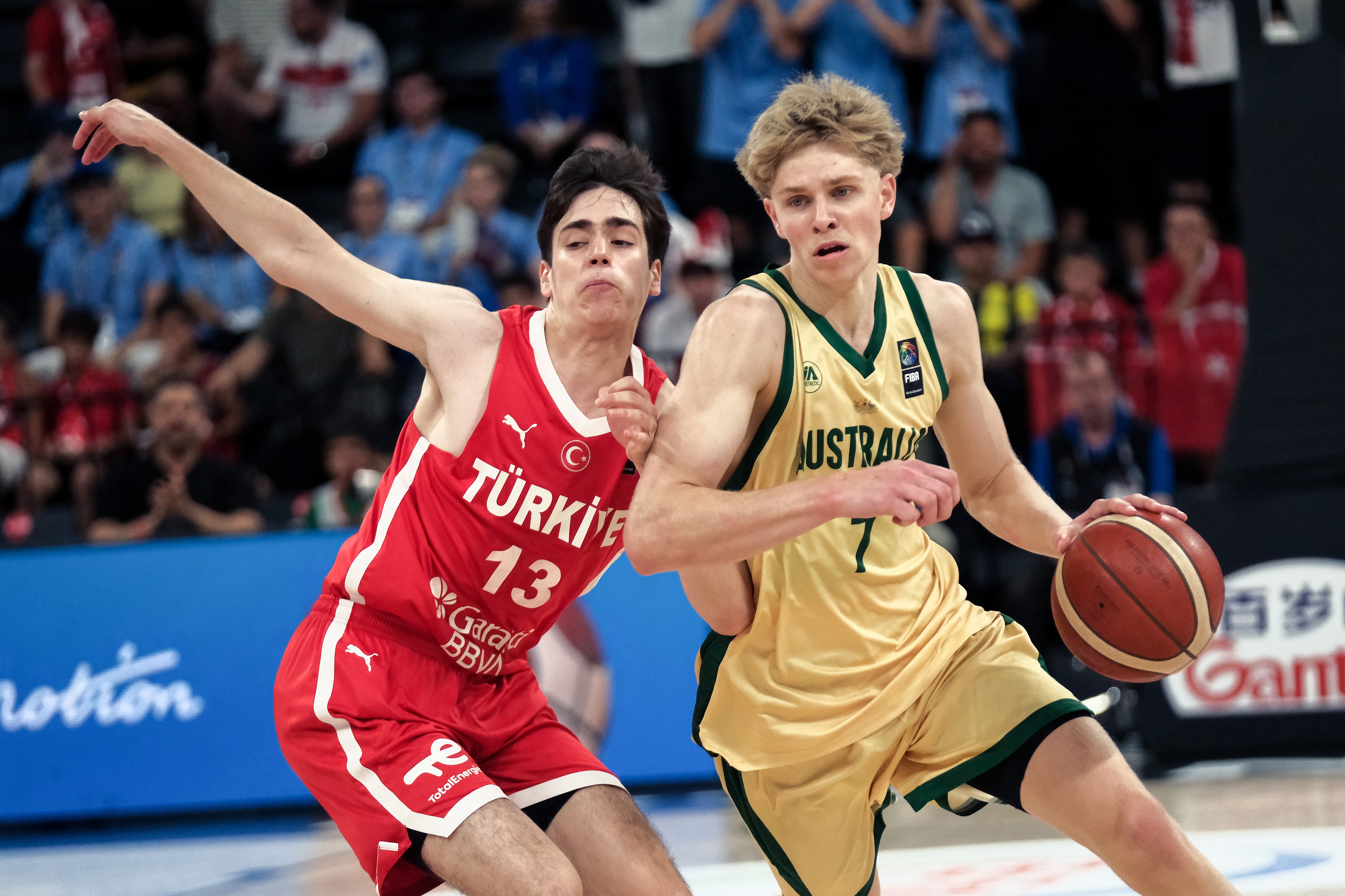 Australian prospect Luke Paul dribbles past a Turkish defender during the 2026 FIBA U17 Basketball World Cup