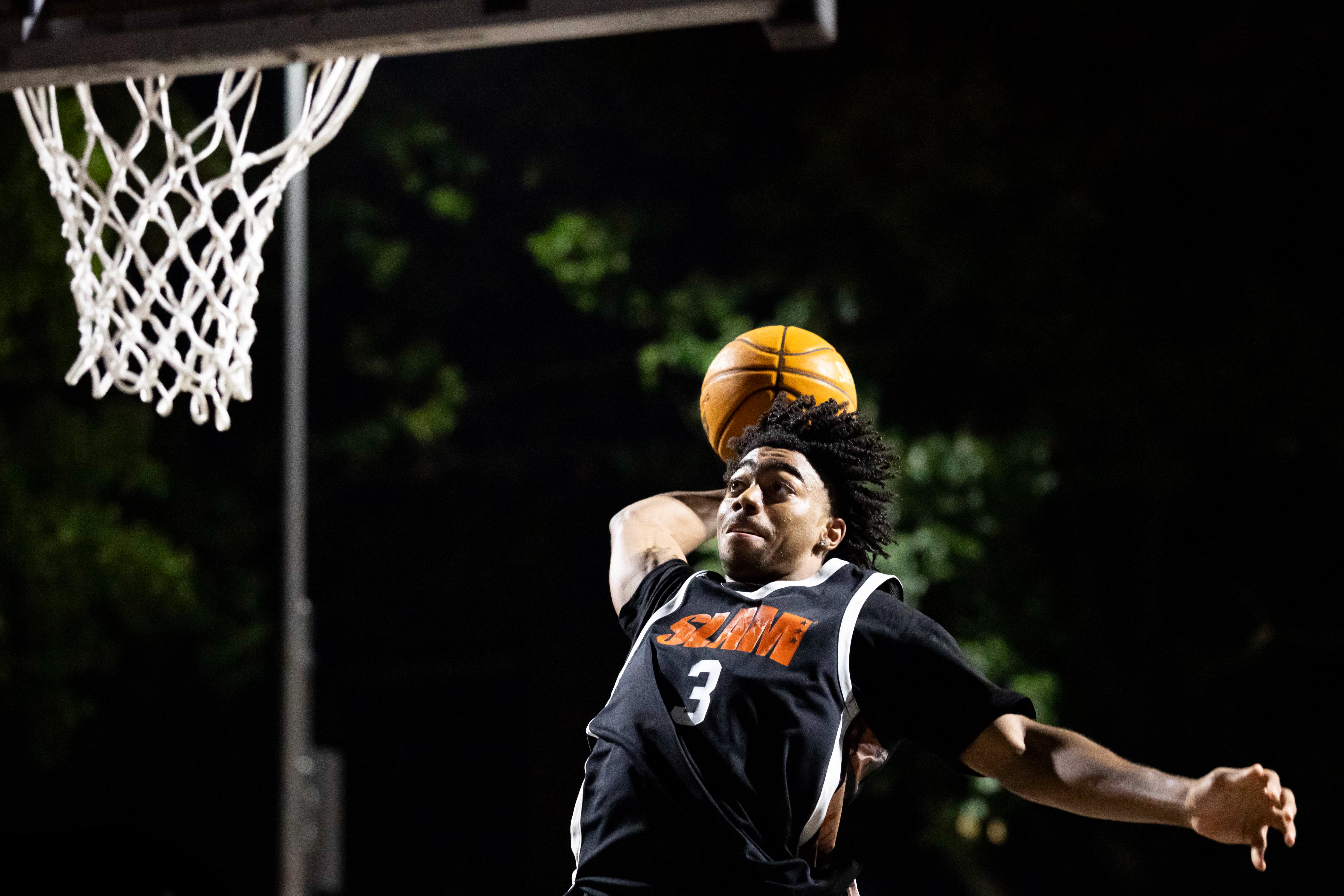 Reese Alston rising up for a dunk during the SLAM Summer Classic at Rucker Park