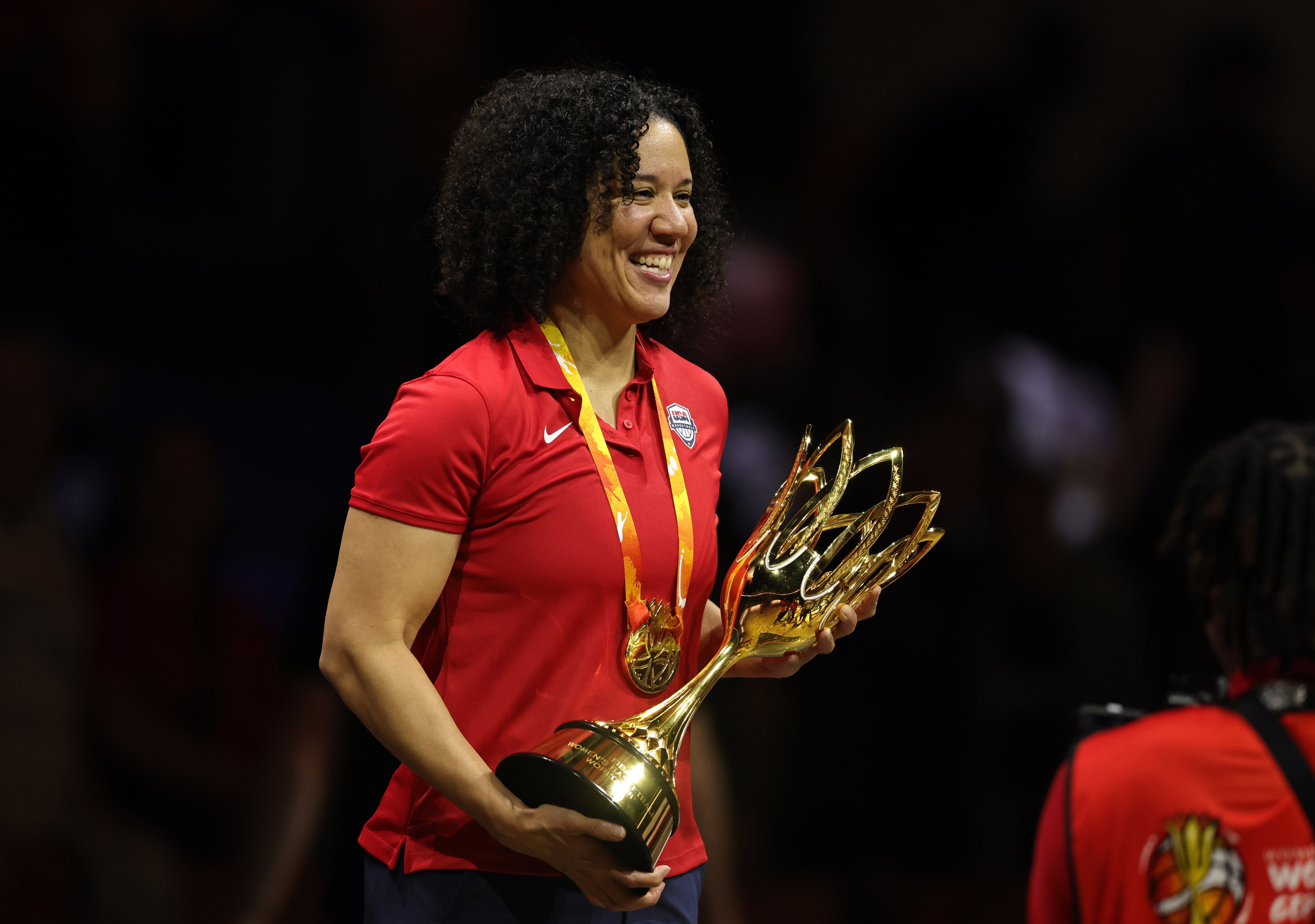 Team USA head coach Kara Lawson poses with the FIBA World Cup trophy