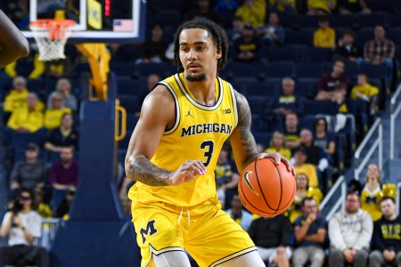 Elliot Cadeau dribbles the ball up court for Michigan