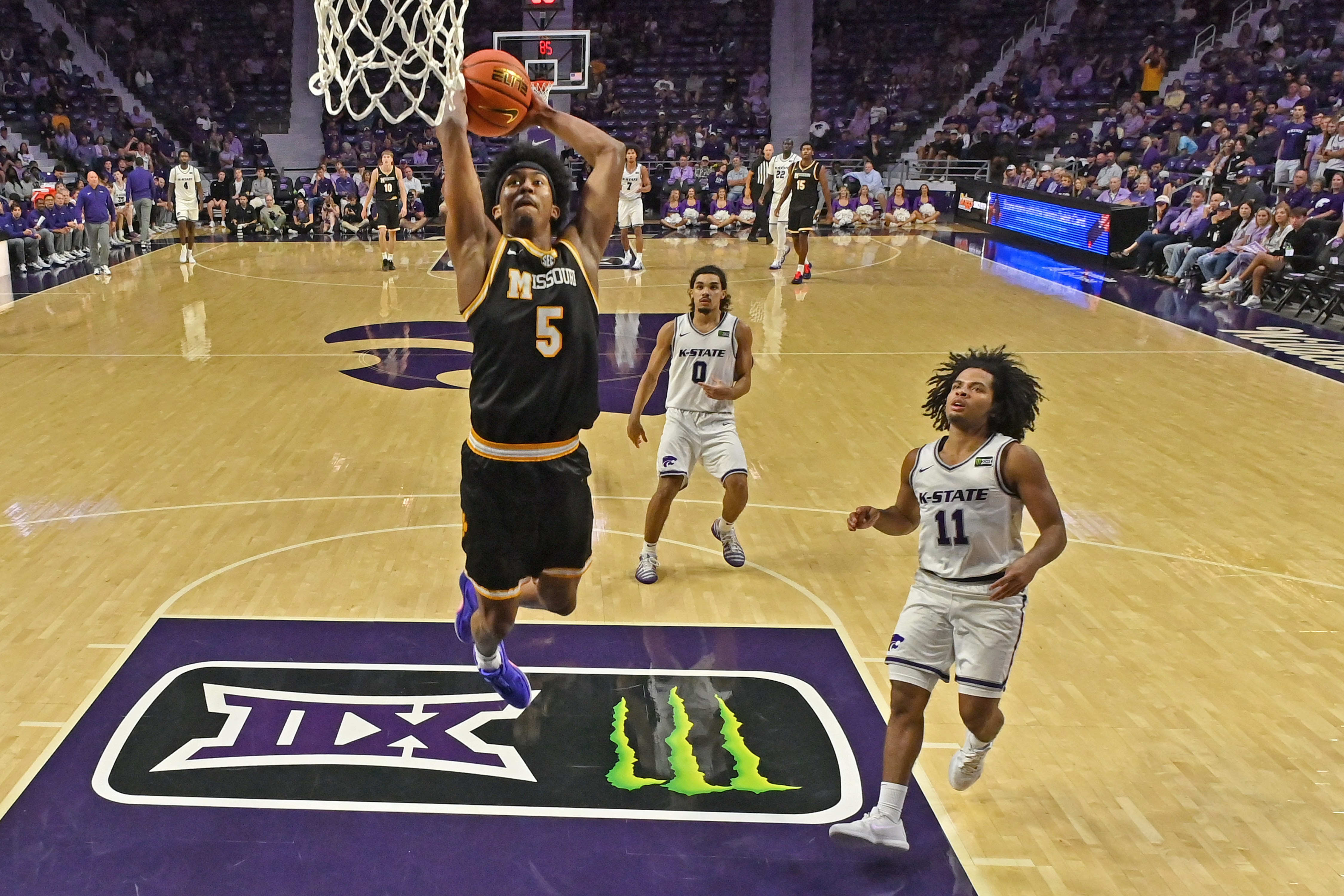 Missouri guard Jason Crowe Jr. goes up for a dunk